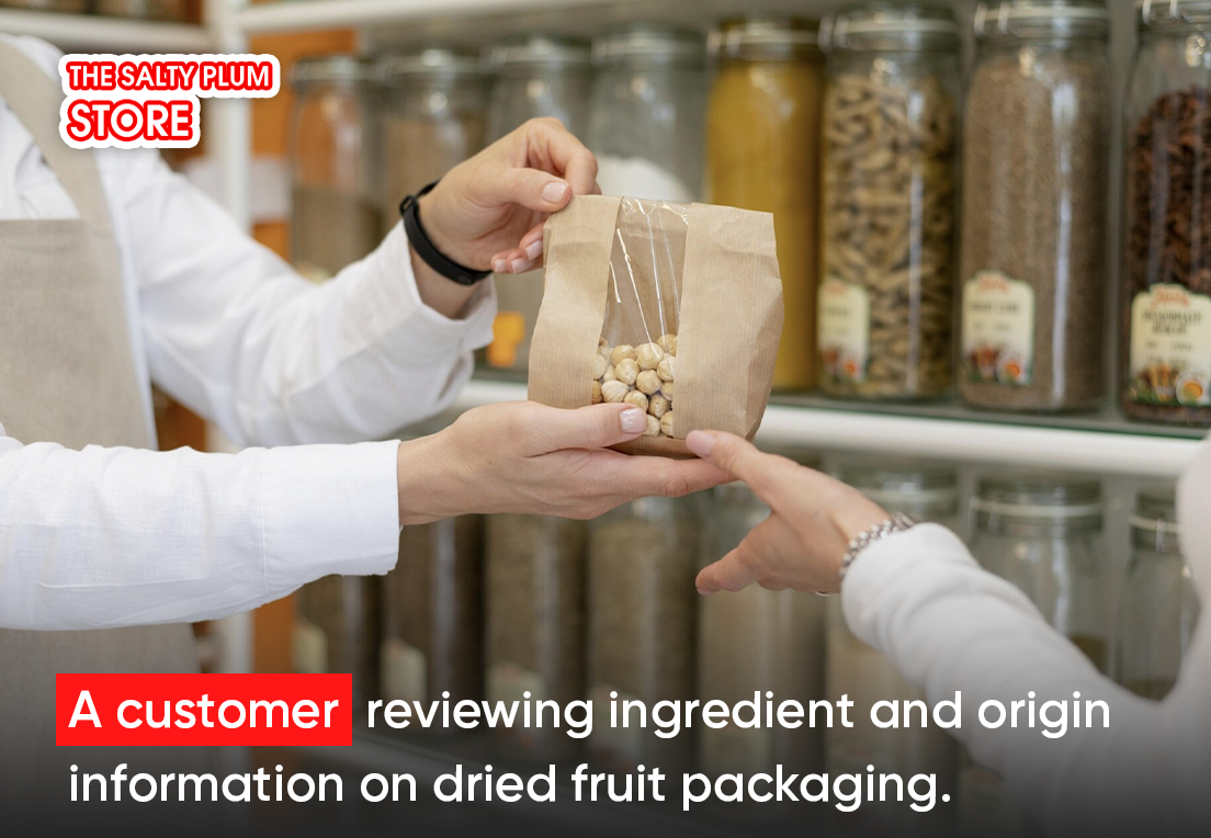 A customer reviewing ingredient and origin information on dried fruit packaging.